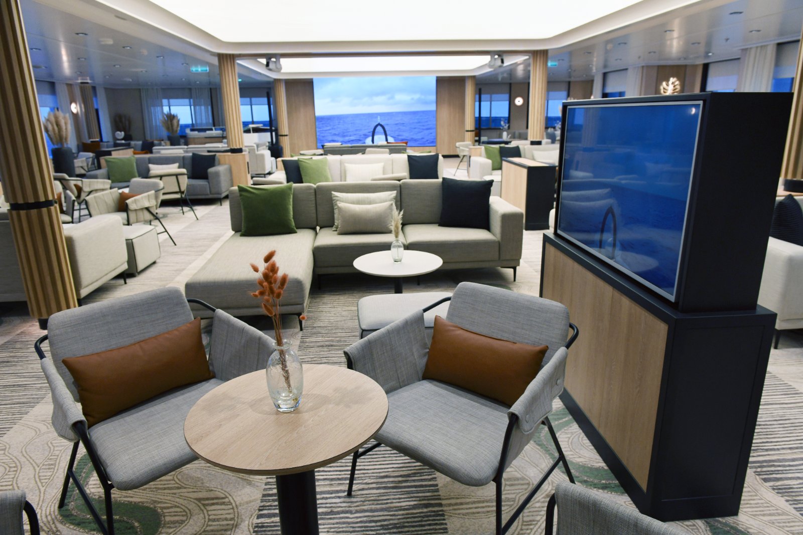 Observation Lounge of a Swan Hellenic ship with armchairs and panoramic sea views
